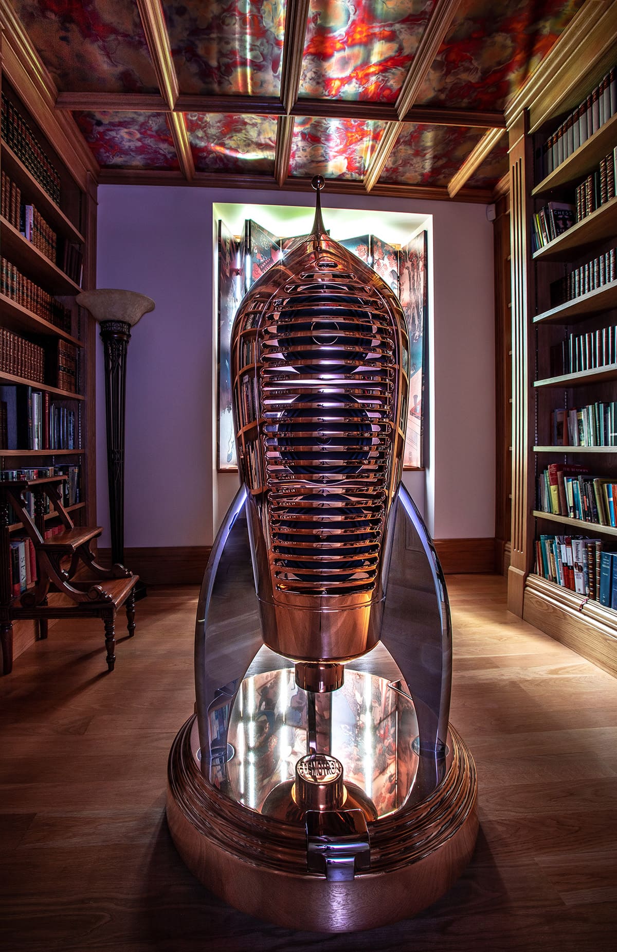 Reflections of the library. The stunning Cosmotron 130 reflects its realities.